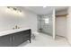 Bathroom featuring a modern vanity, new toilet, and glass-enclosed shower at 3304 7Th Street W Ct, Palmetto, FL 34221