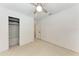 Bedroom showcasing a ceiling fan, closet, and neutral walls at 3304 7Th Street W Ct, Palmetto, FL 34221