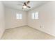 Bedroom showcasing a ceiling fan, plantation shutters, and neutral walls at 3304 7Th Street W Ct, Palmetto, FL 34221
