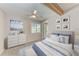Cozy bedroom featuring ceiling fan, decorative artwork, and comfortable bed at 3304 7Th Street W Ct, Palmetto, FL 34221