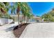 Beautifully landscaped front yard features a charming home with stylish shutters and a freshly painted exterior at 3304 7Th Street W Ct, Palmetto, FL 34221