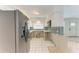 Updated kitchen with stainless steel refrigerator and modern countertops at 3304 7Th Street W Ct, Palmetto, FL 34221