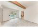Bright room with tile floors, decorative beam, and French doors leading to a pool at 3304 7Th Street W Ct, Palmetto, FL 34221