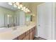 Bathroom featuring double sinks, a soaking tub, and a separate shower at 428 Grand Preserve Cv, Bradenton, FL 34212