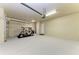 Spacious, clean garage offers ample storage space with an included golf cart at 428 Grand Preserve Cv, Bradenton, FL 34212
