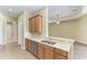Functional kitchen with stainless steel dishwasher and a view to the living area at 428 Grand Preserve Cv, Bradenton, FL 34212