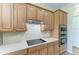 Close-up of oven in a kitchen with light wood cabinets and white countertops at 428 Grand Preserve Cv, Bradenton, FL 34212