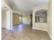 Spacious open floor plan with wood-look floors, neutral walls, and recessed lighting at 428 Grand Preserve Cv, Bradenton, FL 34212