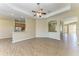 Open concept living room with hardwood floors and lots of open space at 428 Grand Preserve Cv, Bradenton, FL 34212