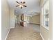 Spacious open-concept living area featuring hardwood floors and natural light from the large window at 428 Grand Preserve Cv, Bradenton, FL 34212