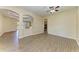 Spacious living area with wood-look floors and arched doorways at 428 Grand Preserve Cv, Bradenton, FL 34212