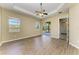 Spacious main bedroom with a ceiling fan and sliding glass doors for lanai access at 428 Grand Preserve Cv, Bradenton, FL 34212