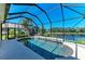 Screened pool with water feature offers clear water and beautiful lake views at 428 Grand Preserve Cv, Bradenton, FL 34212
