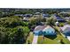An aerial view of a single story home, landscaped yard, driveway, and surrounding neighborhood at 4360 Flamingo Blvd, Port Charlotte, FL 33948