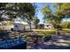 Spacious backyard with mature trees, shed, and a brick patio area at 4360 Flamingo Blvd, Port Charlotte, FL 33948