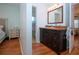 Bathroom with dark vanity, granite counters, and access to shower room at 4360 Flamingo Blvd, Port Charlotte, FL 33948