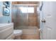 Cozy bathroom featuring a tiled shower with glass doors and a white vanity at 4360 Flamingo Blvd, Port Charlotte, FL 33948