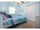 Cozy bedroom with carpet, a bed, closet, and a window at 4360 Flamingo Blvd, Port Charlotte, FL 33948