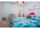 Bright bedroom with a tropical-themed comforter set and fresh decorations at 4360 Flamingo Blvd, Port Charlotte, FL 33948