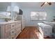 Well-lit bedroom with hardwood floors, large dressers, and a comfortable atmosphere at 4360 Flamingo Blvd, Port Charlotte, FL 33948