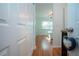 View from doorway into bedroom featuring wood floors and a sunny window at 4360 Flamingo Blvd, Port Charlotte, FL 33948