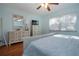 Tranquil bedroom featuring soft blue walls, hardwood floors, and comfortable bedding at 4360 Flamingo Blvd, Port Charlotte, FL 33948