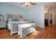 Bedroom with hardwood floors, ceiling fan, and a full bathroom at 4360 Flamingo Blvd, Port Charlotte, FL 33948