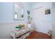 Bright foyer with decorative bench, mirror, and artwork that creates an inviting entrance at 4360 Flamingo Blvd, Port Charlotte, FL 33948