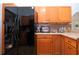 Bright kitchen features granite countertops, wood cabinets and stainless steel appliances at 4360 Flamingo Blvd, Port Charlotte, FL 33948