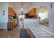 Bright kitchen featuring wooden cabinets, access to patio, and an open floor plan at 4360 Flamingo Blvd, Port Charlotte, FL 33948