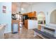 Open kitchen with breakfast nook, wooden cabinets, and stainless steel appliances at 4360 Flamingo Blvd, Port Charlotte, FL 33948