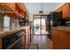 Beautiful kitchen with wooden cabinets, tile backsplash, and stainless steel appliances at 4360 Flamingo Blvd, Port Charlotte, FL 33948
