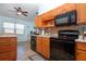 Charming kitchen with vaulted ceilings and sleek black appliances is the heart of this home at 4360 Flamingo Blvd, Port Charlotte, FL 33948