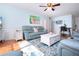 Bright living room with hardwood floors, comfortable seating, flamingo art, and stylish furniture at 4360 Flamingo Blvd, Port Charlotte, FL 33948