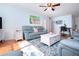 Bright living room with hardwood floors, comfortable seating, flamingo art, and stylish furniture at 4360 Flamingo Blvd, Port Charlotte, FL 33948