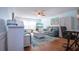 Bright living room features coastal decor, blue walls, hardwood floors, and comfortable seating at 4360 Flamingo Blvd, Port Charlotte, FL 33948