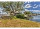 Lush green backyard next to the canal and boat dock at 4406 17Th W St, Palmetto, FL 34221