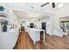 Open concept kitchen with white cabinets, an island with seating, and stainless steel appliances at 4406 17Th W St, Palmetto, FL 34221