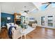Inviting living room with stone fireplace, wood floors, and vaulted ceilings with lots of natural light at 4406 17Th W St, Palmetto, FL 34221