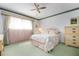 Bright bedroom with a ceiling fan, and a plush floral patterned bed at 4440 Ironwood Cir # 509D, Bradenton, FL 34209