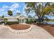 Exterior view of the community clubhouse with manicured landscaping and signage at 4440 Ironwood Cir # 509D, Bradenton, FL 34209