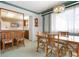 Cozy dining area with a chandelier, natural lighting, and seating for six at 4440 Ironwood Cir # 509D, Bradenton, FL 34209