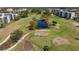 Scenic aerial view of a well-maintained golf course with lush green fairways and serene water features at 4440 Ironwood Cir # 509D, Bradenton, FL 34209