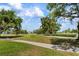 Lush golf course view showcasing manicured greens and mature trees at 4440 Ironwood Cir # 509D, Bradenton, FL 34209