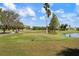 Scenic view of a meticulously maintained golf course with a clear blue sky at 4440 Ironwood Cir # 509D, Bradenton, FL 34209