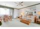 Bright living room featuring a ceiling fan, neutral paint, and space for a dining area at 4440 Ironwood Cir # 509D, Bradenton, FL 34209