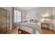 Cozy bedroom with natural light, modern decor, and hardwood flooring at 446 Burns Ct, Sarasota, FL 34236