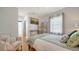 Relaxing bedroom featuring a comfortable bed, window, and closet access for ample storage at 446 Burns Ct, Sarasota, FL 34236
