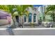 Charming home featuring unique architecture, beautiful windows, and lush landscaping at 446 Burns Ct, Sarasota, FL 34236