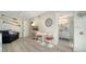 Coastal-themed living room with nautical decor and an adjacent bathroom, creating a charming and cohesive space at 446 Burns Ct, Sarasota, FL 34236
